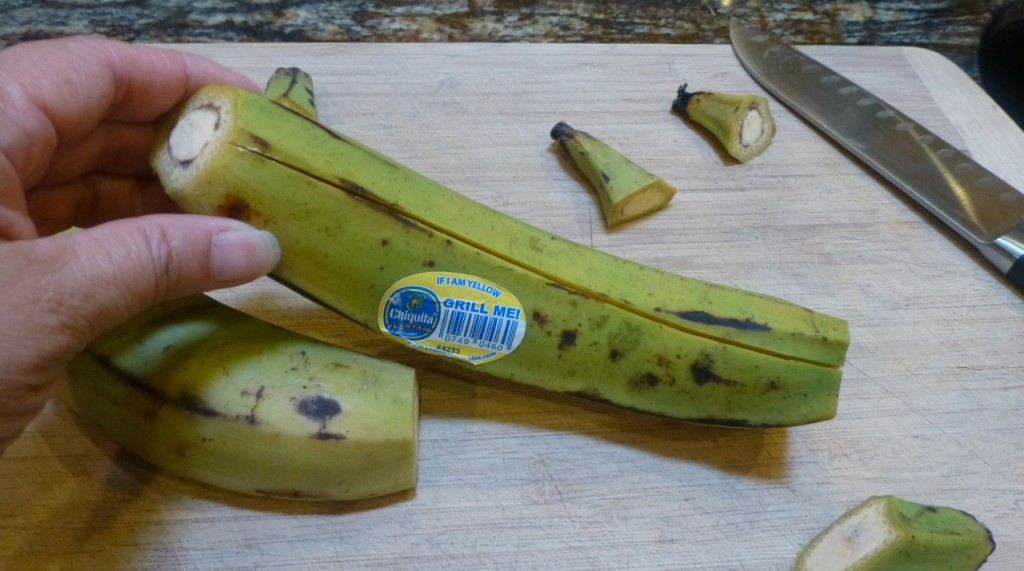 Cut the tips off plantain then slit down the middle