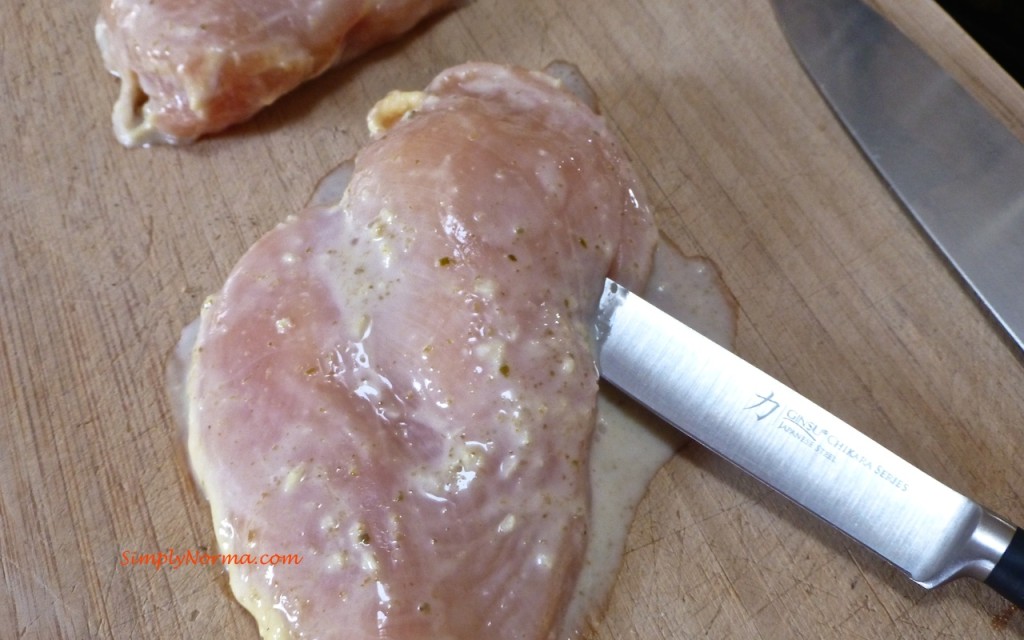 Slice chicken breasts to stuff