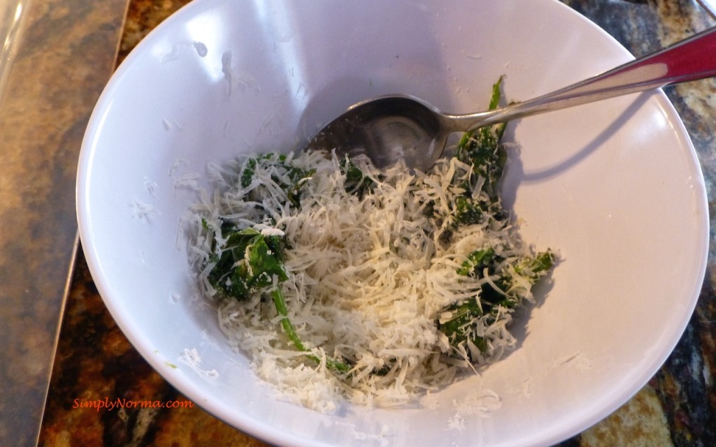 Combine the spinach and grated cheese